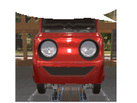 a red car with a smiling face on the front of it