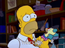 a cartoon of homer simpson holding a stuffed clown with the words that 's bad below him