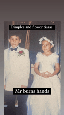 a boy in a tuxedo and a girl in a flower girl dress standing next to each other