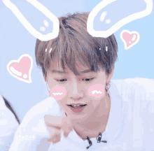 a boy with bunny ears and pink hearts on his head