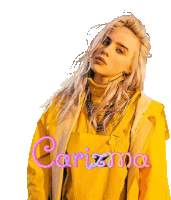 billie eilish is wearing a yellow coat and overalls