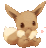 a brown eevee is sitting on a white surface with its paws on its face .