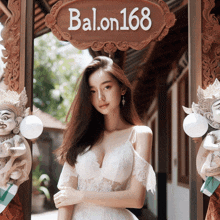 a woman in a white dress stands under a sign that says balon168