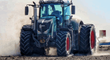 a man is driving a fendt tractor in a dirt field