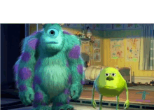 two monsters from the movie monsters inc standing next to each other