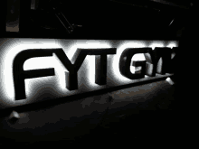 a black and white sign that says fytgyn