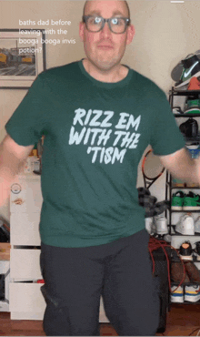 a man wearing a green shirt that says rizz em with the tism