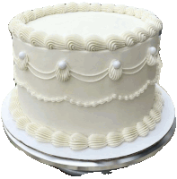 a white cake with white frosting and pearls