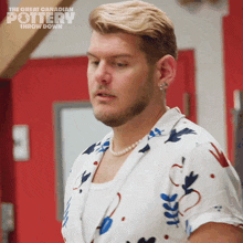 a man wearing a pearl necklace is featured on the great canadian pottery throw down show