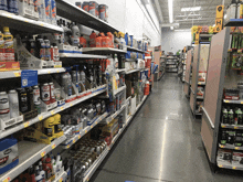 a store aisle filled with lots of cleaning products including clorox