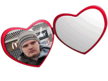 a heart shaped mirror shows a man in front of a mcdonald 's sign