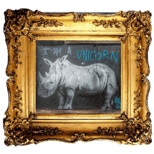 a framed painting of a rhino with the words " i am a unicorn " written on it