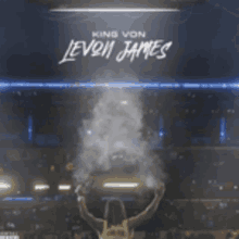 a king von levon james album cover shows a basketball player holding a trophy