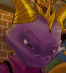 a close up of a purple cartoon character with horns and a crown on his head .