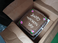 a chocolate cake that says happy teachers day on it