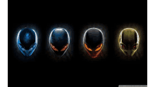 four different colored alien heads are lined up in a row