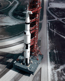 an aerial view of a saturn v rocket on a platform