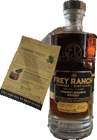 a bottle of frey ranch bourbon whiskey with spearmint seeds on the back