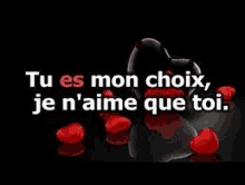 a black background with hearts and the words `` tu es mon choix , je n'aime que toi '' .