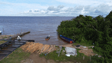 an aerial view of a body of water with a boat in the distance