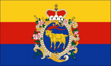 a red yellow and blue flag with a goat and a crown on it