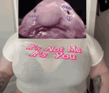 a woman is wearing a white shirt that says it 's not me it 's you