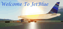 a welcome to jet blue sign with a plane on the runway