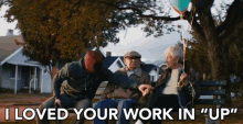 a group of people sitting on a bench with the words " i loved your work in " up "