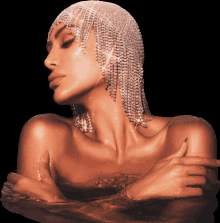 a naked woman in a bathtub with a headpiece made of rhinestones