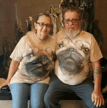 a man and a woman wearing matching pug shirts