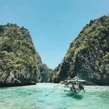 a boat with people on it is floating in the water