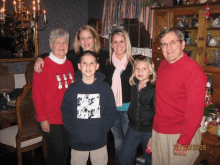 a group of people posing for a picture with the date 12/24/2009