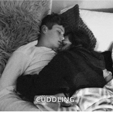 a black and white photo of a man and woman hugging with the caption cuddleng