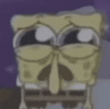 a close up of spongebob squarepants ' face with a skeleton 's nose .