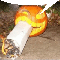 a pumpkin carved to look like a cigarette has a speech bubble above it