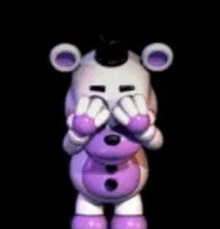 a white and purple teddy bear is covering its eyes with its hands in a dark room .