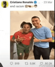 cristiano ronaldo and a black man are posing for a picture together