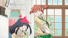 a couple of anime girls are fighting in a room