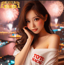 a woman wearing a toto macau shirt is standing in front of fireworks