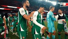 a group of soccer players are standing on a field with a sign in the background that says ' prijsvru '