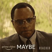 a man wearing glasses and a suit says maybe in a prime video ad