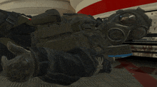 a person wearing a gas mask and gloves laying on the floor