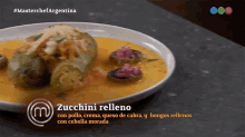 a plate of zucchini relleno from masterchef argentina is on a table