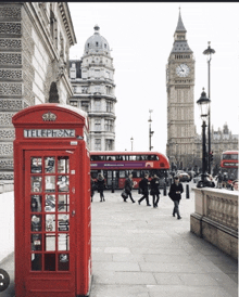 a red telephone booth in front of the big ben