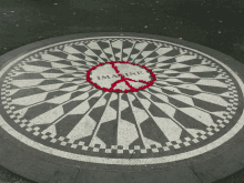 a black and white mosaic with the word imagine in the middle