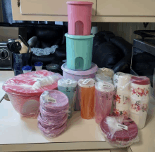 a bunch of plastic containers including one that says tupperware