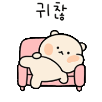 a teddy bear is laying on a pink couch with korean writing .