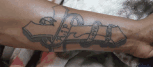 a tattoo on a person 's arm that says rip love on it