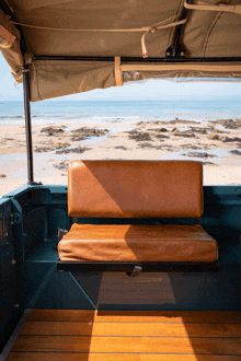 the back seat of a vehicle with a view of a beach