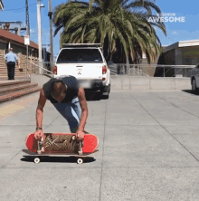 a man is doing a trick on a skateboard in front of a truck that says awesome on the side